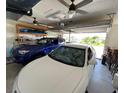 Spacious two-car garage with ample storage shelving at 132 Peckham Se St, Port Charlotte, FL 33952