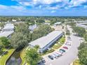 Aerial view of condo building near lake and road at 8320 112Th St # 104, Seminole, FL 33772
