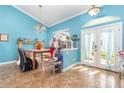 Bright dining room with a fireplace and access to the backyard at 5267 Weatherton St, North Port, FL 34288