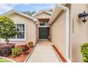 Welcoming front entry with walkway and landscaping at 13235 Meadow Golf Ave, Hudson, FL 34669