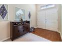 Bright entryway with hardwood floors and decorative accents at 13235 Meadow Golf Ave, Hudson, FL 34669