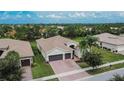 Single-Gathering home with two-car garage and spacious backyard at 16005 Cape Coral Dr, Wimauma, FL 33598