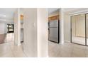 Bright hallway connecting living areas to the kitchen at 10155 Sailwinds S Blvd # 104, Largo, FL 33773