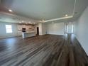 Open-concept living area with sleek flooring, recessed lighting, and a bright, inviting atmosphere at 16044 7Th E Ave, Bradenton, FL 34212