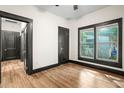 Bright bedroom with wood floors and updated doors at 2111 Burlington N Ave, St Petersburg, FL 33713