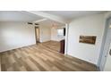 Bright living room with wood floors, a decorative fireplace, and ample natural light at 4851 W Gandy Blvd # B11L35, Tampa, FL 33611