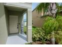 Inviting front entry with a charming welcome sign at 1307 Pasadena Bloom Ln, Ruskin, FL 33570