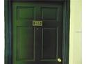 A close-up of a solid front door with clear unit number, ensuring easy identification at 3206 W Azeele St # 225, Tampa, FL 33609