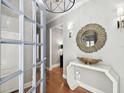 Bright entryway with a statement mirror and unique console table at 4811 W Woodmere Rd, Tampa, FL 33609