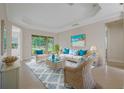 Spacious living room with wicker furniture and a large window at 4963 Sapphire Sound Dr, Wimauma, FL 33598