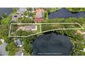 Aerial view showing house and lot location by the lake at 2220 Linda Ln, Lutz, FL 33558