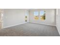 Cozy bedroom with neutral carpet, natural light, and access to exterior at 12977 Long Valley Cir, Spring Hill, FL 34609