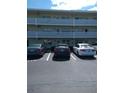 Two-story building with parking lot and cars at 8100 Dr Martin Luther King Jr N St # 208, St Petersburg, FL 33702