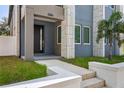 Modern entryway with gray door and white steps at 2138 -1 W Beach St, Tampa, FL 33607