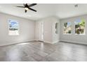 Spacious living area with tile floors and a ceiling fan at 2138 - 2 W Beach St, Tampa, FL 33607