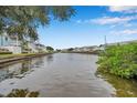 Tranquil waterfront view of a canal with boats and lush greenery at 5176 Salmon Se Dr # A, St Petersburg, FL 33705