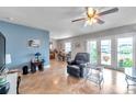 Bright living room featuring a recliner, and access to a patio overlooking the water at 5176 Salmon Se Dr # A, St Petersburg, FL 33705