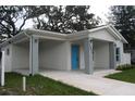 Single-story home with a covered porch and well maintained lawn at 4004 E Osborne Ave, Tampa, FL 33610