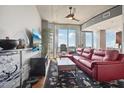 Living room with red sectional sofa and city views at 777 N Ashley Dr # 1606, Tampa, FL 33602