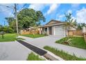 Front view of house and driveway at 1710 E Nome St, Tampa, FL 33604