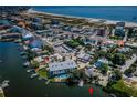 An aerial view shows the proximity of this waterfront property to the beach and many local amenities at 11921 Lagoon Ln, Treasure Island, FL 33706