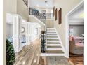 Elegant entryway with a grand staircase and wood flooring at 12506 Ashdown Dr, Odessa, FL 33556