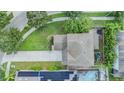 Aerial view of a house with a pool, solar panels, and a large backyard at 8221 Nectar Ridge Ct, Odessa, FL 33556