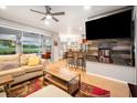 Spacious living room with comfortable seating, large TV, and access to backyard at 4940 Willow Ridge Ter, Valrico, FL 33596