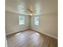 Bright bedroom with two windows and ceiling fan at 1650 Prescott S St, St Petersburg, FL 33712