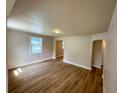 Spacious living room with light walls and wood floors at 1650 Prescott S St, St Petersburg, FL 33712