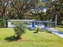 Updated Ranch home with a blue door and carport at 815 St Francis St, Brooksville, FL 34601