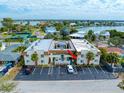 Aerial view of condo building with parking and surrounding area at 2704 2Nd St # 7, Indian Rocks Beach, FL 33785