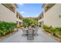 Courtyard with seating area and tropical landscaping at 2704 2Nd St # 7, Indian Rocks Beach, FL 33785