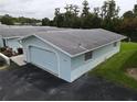Aerial view showcasing a light blue house and its surroundings at 12026 Boynton Ln # Gb32, New Port Richey, FL 34654