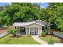 Housetop view of a charming bungalow with a well-manicured lawn at 502 E Hugh St, Tampa, FL 33603