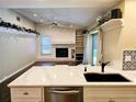 Modern kitchen with quartz countertops and stainless steel appliances at 3582 Fairway Forest Dr, Palm Harbor, FL 34685