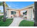 Inviting front patio with seating at 250 Rosery Nw Rd # 351, Largo, FL 33770