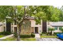 Condo building with stone accents and landscaping at 1400 Tarpon Woods Blvd # B5, Palm Harbor, FL 34685