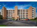 Exterior view of a condominium building with parking and landscaping at 6450 Shoreline Dr # 9405, St Petersburg, FL 33708