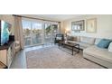 Bright living room with sectional sofa and water views at 2505 Bay Blvd # 1, Indian Rocks Beach, FL 33785