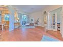 Spacious living area with hardwood floors, featuring an open floor plan and natural light at 4923 Willow Ridge Ter, Valrico, FL 33596