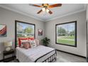 Cozy bedroom with a comfortable bed, large windows, and stylish decor at 402 E Emma St, Tampa, FL 33603