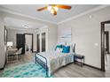 Bedroom with teal rug and en-suite bathroom at 402 E Emma St, Tampa, FL 33603