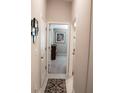 Bright hallway with carpet and access to bedrooms at 14117 Weddington Ter, Hudson, FL 34669