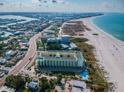 Aerial view of coastal property showing building, beach, and surrounding area at 12000 Gulf Blvd # 206N, Treasure Island, FL 33706