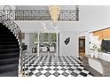 Grand foyer featuring high ceilings, a stunning chandelier, and black and white flooring at 45 Adalia Ave, Tampa, FL 33606