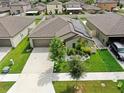Single-Gathering home with solar panels and landscaped yard at 15407 Miller Creek Dr, Sun City Center, FL 33573
