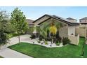 Single-story home with a landscaped front yard, driveway, and two-car garage at 15407 Miller Creek Dr, Sun City Center, FL 33573