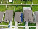 Aerial view showcasing a neighborhood with houses and lush green spaces at 15407 Miller Creek Dr, Sun City Center, FL 33573