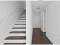 Modern staircase with dark wood steps at 4921 W Paul Ave # 7, Tampa, FL 33611